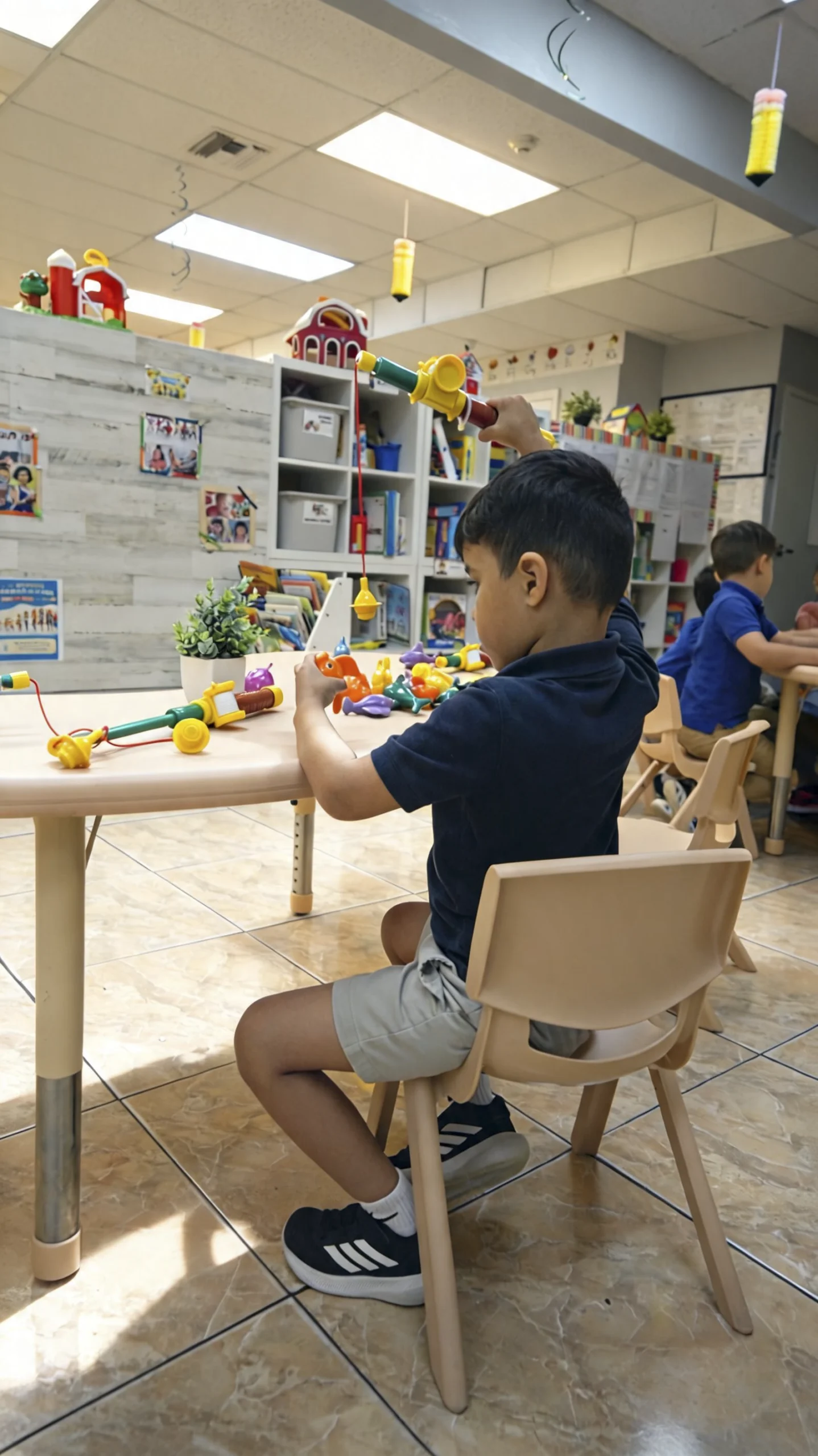 A preschool student reading an illustrated storybook during an early literacy activity at My Little Blue Honey Comb.
